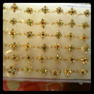 Case of 48 ladies fashion rings size small.